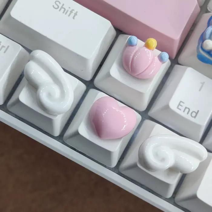 Capuchons de touches directionnels pour clavier mécanique