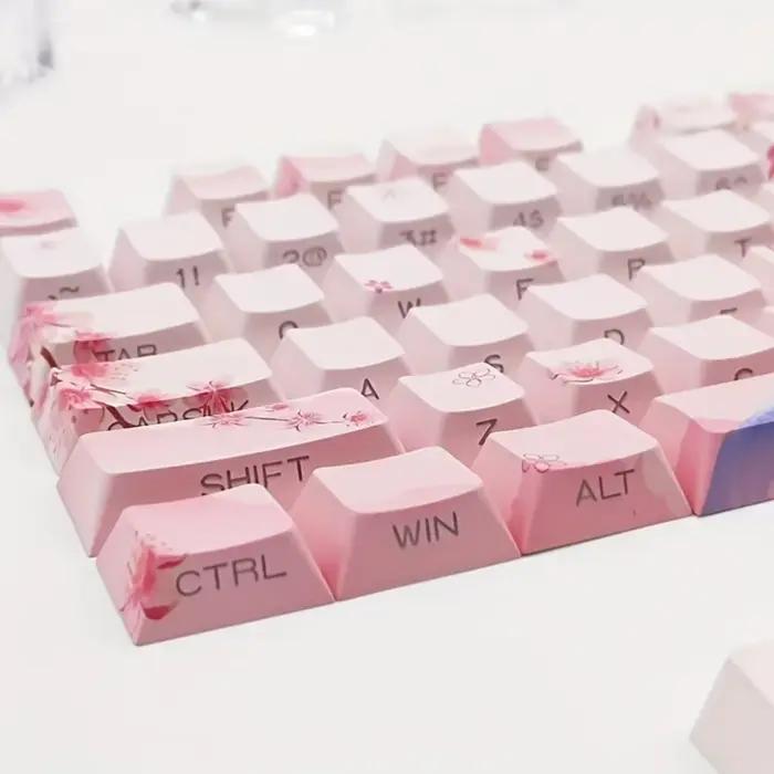 Capuchons de touches de clavier mécanique rose fleur de cerisier 128 touches gravure latérale matériau PBT éclairé pour claviers mécaniques normes et ergonomiques