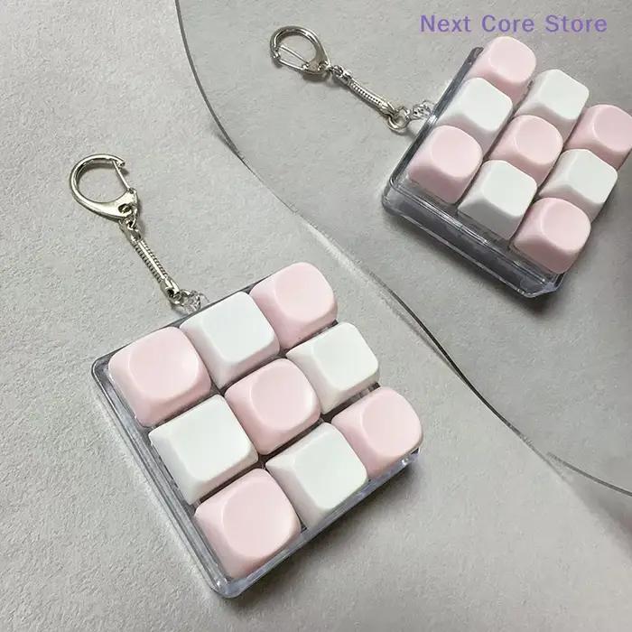 Antistress 9 touches clavier bouton doigt clé capuchon pendentif