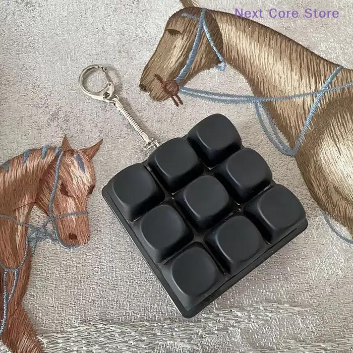 Antistress 9 touches clavier bouton doigt clé capuchon pendentif