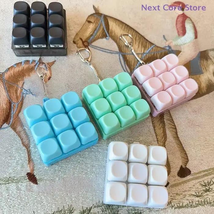 Antistress 9 touches clavier bouton doigt clé capuchon pendentif