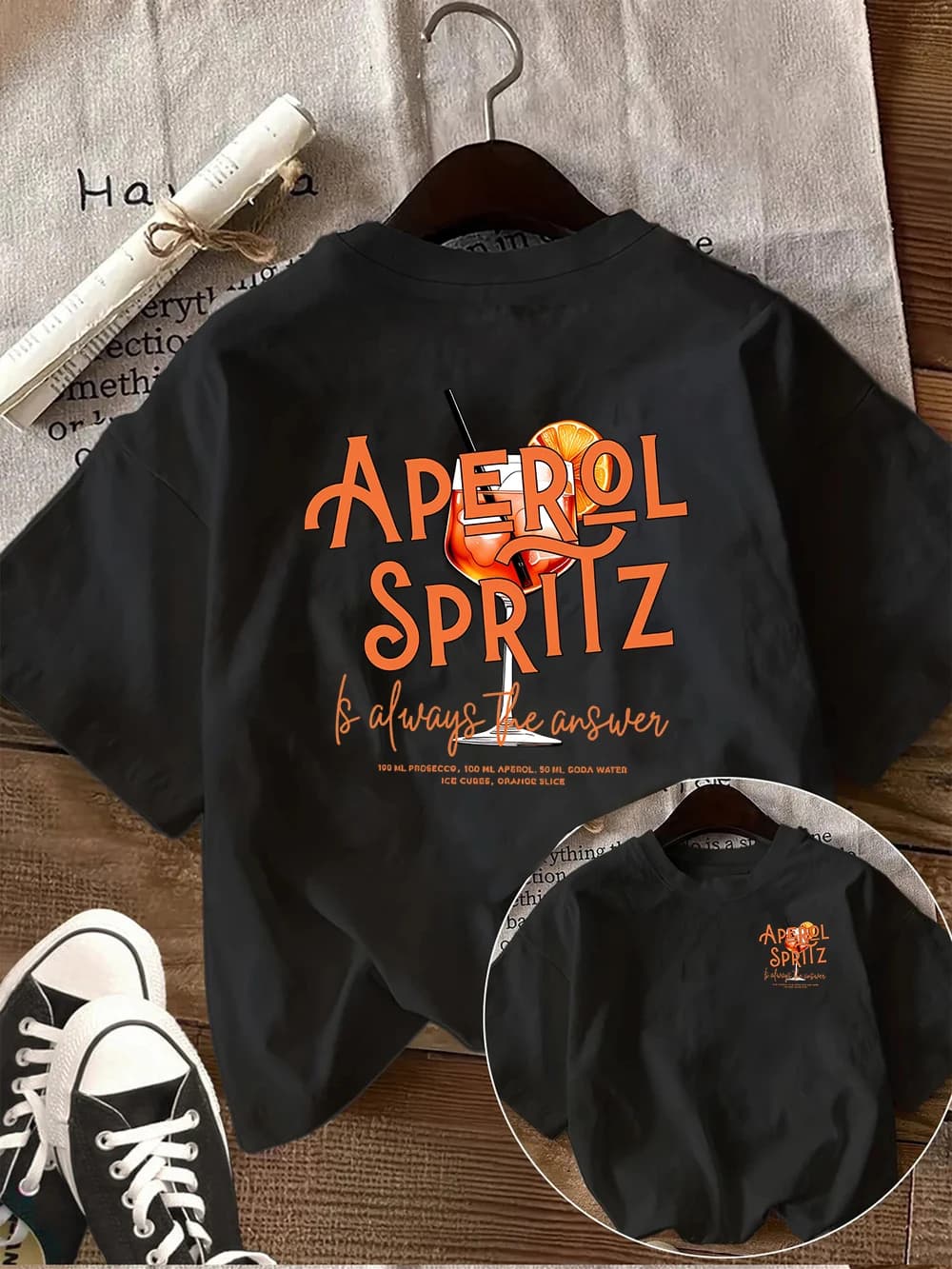 T-shirt graphique Aperol Spritz pour l'été, idéal pour les soirées cocktail, avec slogan amusant sur